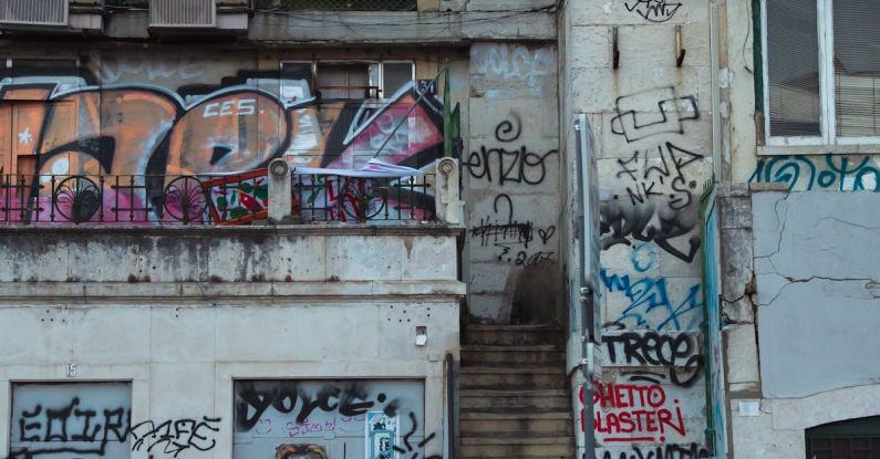 Art Neighborhoods - Exterior of shabby building with graffiti