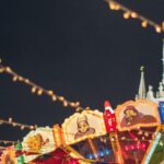 Temple Festivals - Colorful luminous carousel against Kremlin on Red Square at night