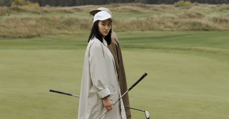 After-Hours Clubs - Woman in Coat in Golf Course