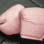 Personal Safety - Boxing gloves on sports mat in gym