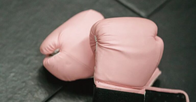 Personal Safety - Boxing gloves on sports mat in gym