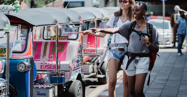 Tuk-Tuks - Happy Women Travelers near Tuk-tuks