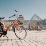 Bicycle Hire - A bicycle parked in front of the louvre