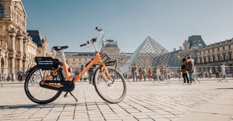 Bicycle Hire - A bicycle parked in front of the louvre