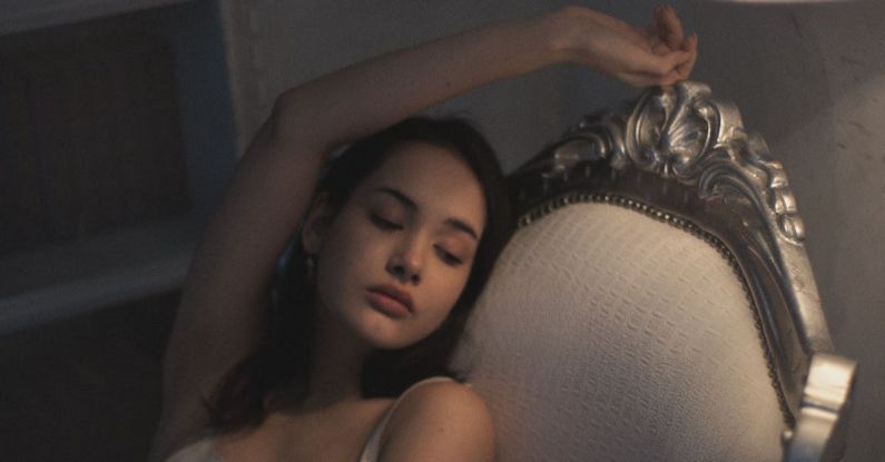 Luxury Retreats - Brunette Woman in Dress Posing on Armchair