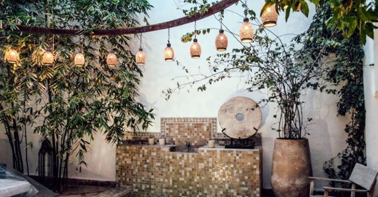 Wellness Resorts - Traditional oriental hammam pool on exotic resort spa terrace decorated with lush plants and stylish lanterns