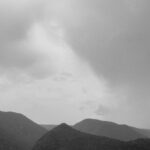Overwater Bungalows - Mountain Landscape with Gray Clouds and Floating Bungalows on a Lake