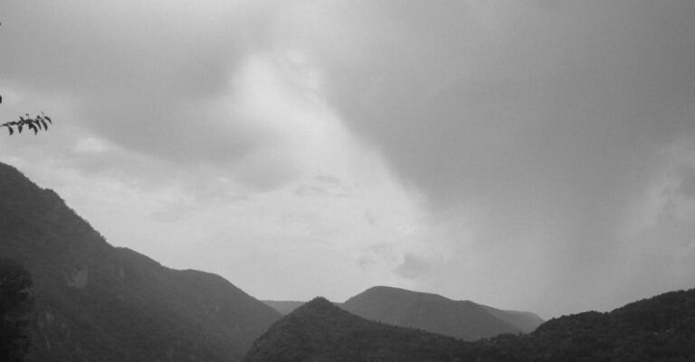 Overwater Bungalows - Mountain Landscape with Gray Clouds and Floating Bungalows on a Lake